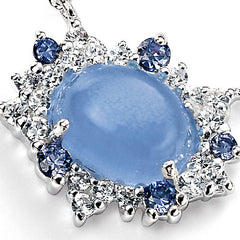 Blue cats eye stone surrounded by cubic zirconia's in clear and lilac set in sterling silver
