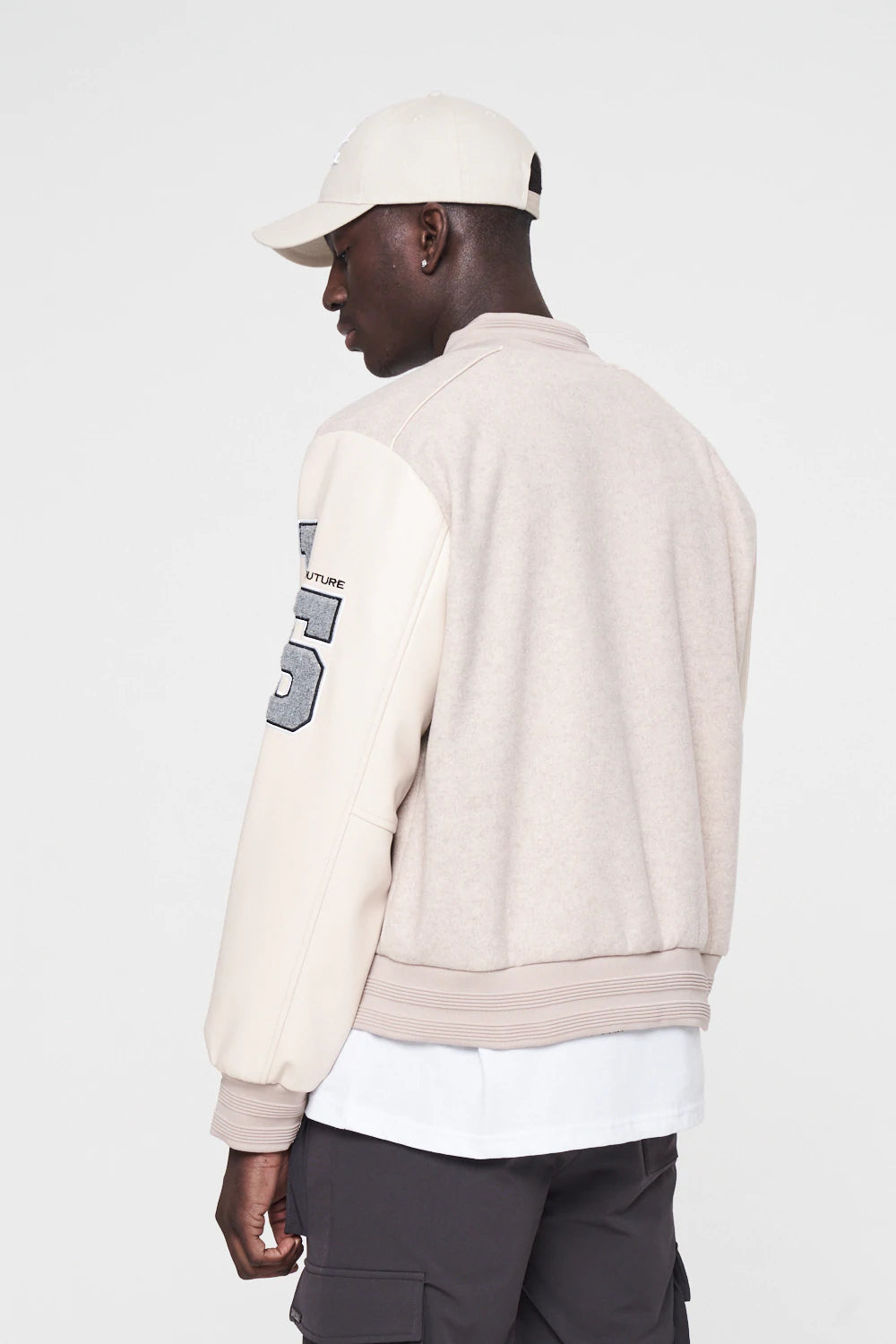 C. CLUB BADGED VARSITY JACKET