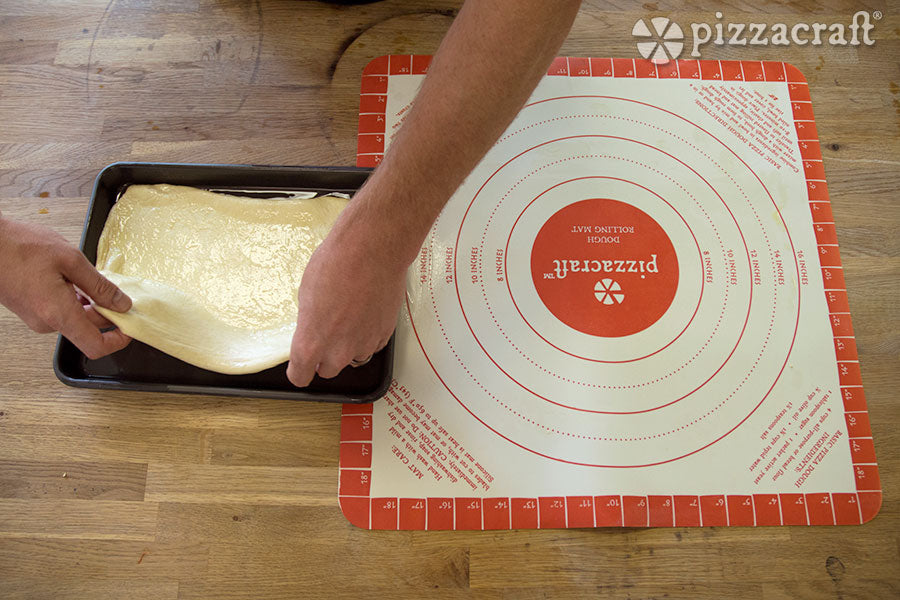 Pull Dough of the Mat and Place it into the Pan