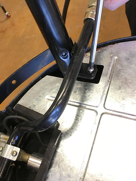 Remove the third screw that secures the gas inlet assembly