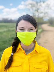 front view of woman in FR Mask in forest