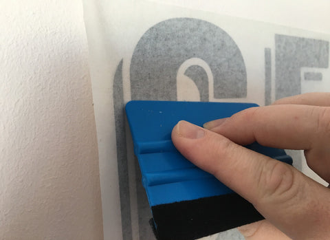 Applying your wall sticker to the wall