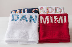 White, red, navy and cream towels