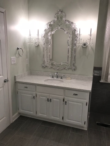 crystal sconces over a vanity