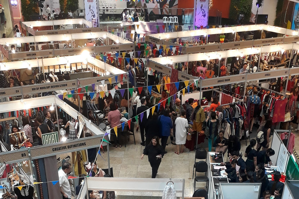 Shoppers at the Likhang Habi Market Fair 2019 in Manila. Philippines for Filipino textiles, crafts, and ethical brands.