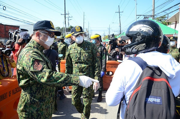 Officers of the Philippine National Police inspecting checkpoints in Bulacan and Pampanga  (on March 19th) to ensure that proper procedures are being followed. 