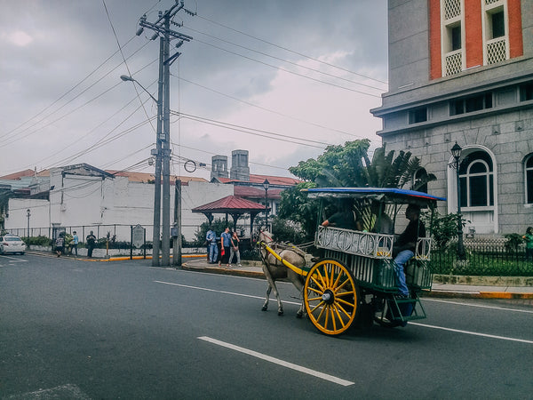 A kalesa tours people around the walled city of Intramuros in Manila