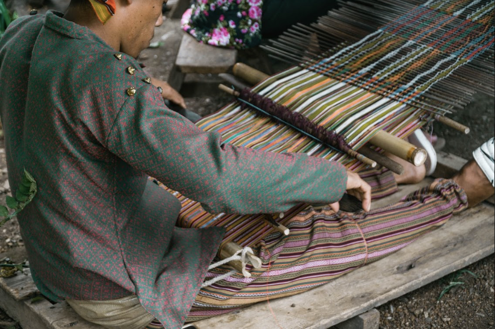 Indigenous artisan weaving a Filipino textile. Photo by AKABA