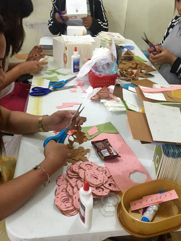 Women preparing the You Complete Me handcrafted card