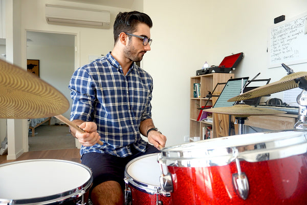 Man Playing Drums Wearing Umizato Blue Light Blocking Computer Glasses For Valentine's Day Date 