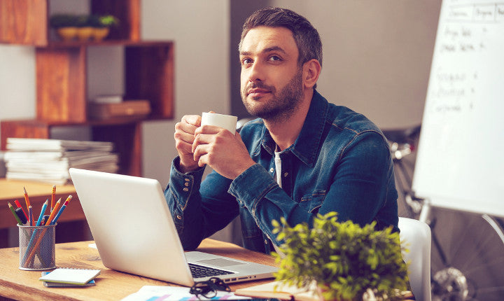 office working man taking computer break and easing eye strain