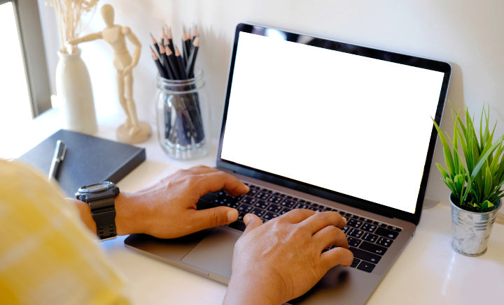 office desk working with bright computer screen on