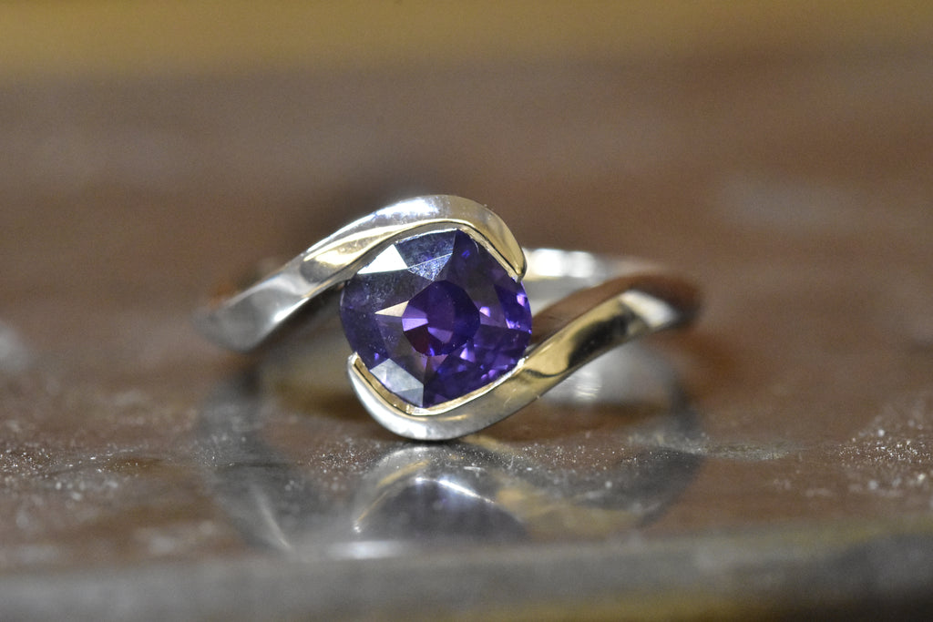 Cushion cut colour change sapphire platinum solitaire engagement ring 