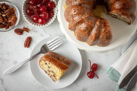 Grey Ghost Bakery German Rum Bundt Cake - Cut Piece on Plate