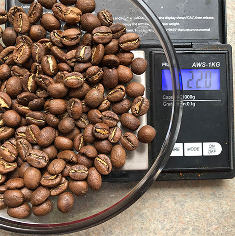 color coffee beans on a scale for pour over coffee