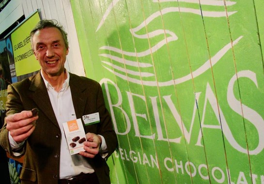 Belvas owner offering the viewer a belgian chocolate truffle