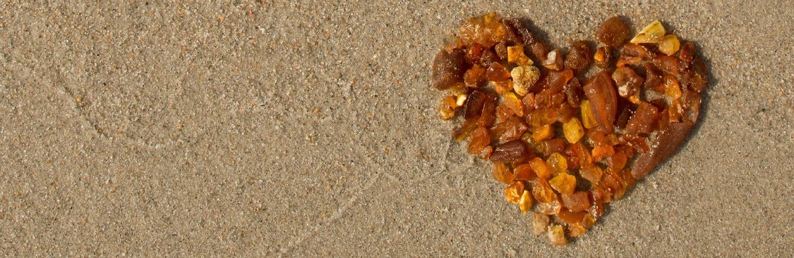 Baltic Amber heart on beach