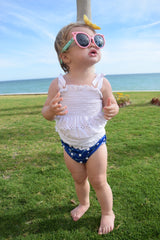 baby with sunglasses and a Beau and Belle Littles swim diaper