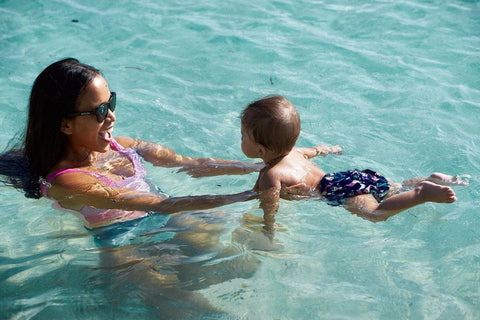 Mommy and Baby wearing reusable swim diaper enjoying the pool