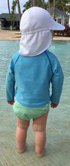 toddler child standing at the pool wearing the Beau and Belle Littles Swim Diaper