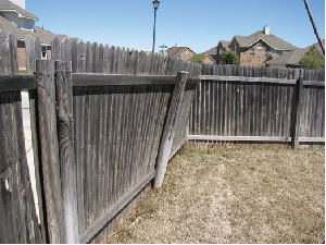 Example wood fence post repair project that can be fixed with a fence post mender