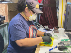 Painting Custom Rings Wearing a Mask at Groove Life