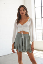 Sage green flowy shorts with ruffle detailing. 