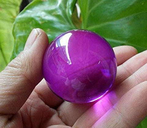 40mm Rose Quartz Crystal Ball. Looks more hot pink. This crystal ball has been a timeless icon of divination and fortune telling for years. Includes Stand and velvet pouch by The Spell Works.