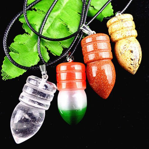 One (1)piece Beautiful mixed stone carved Pendulum. Approx. 2" long by 3/4" wide and comes with a velvet pouch handmade by The Spell Works.