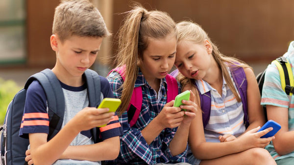 children using mobile phone