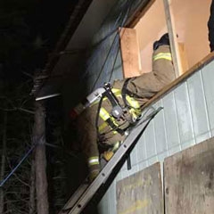 Fire fighter bails out the second floor window head-first!