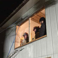 The team can see the outdoor scene from inside the structure.