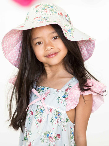 Girl in a blue floral hat