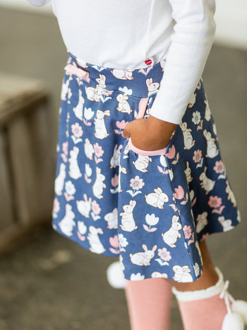 Girl in blue bunny skirt