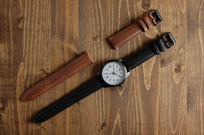 Genuine leather straps are available in black and natural brown