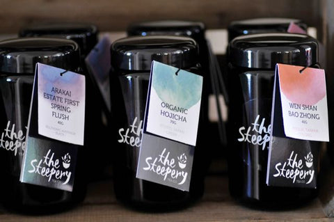 The Steepery Tea Co's black glass tea canisters