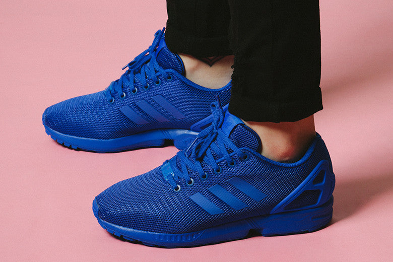 blue adidas flux trainers