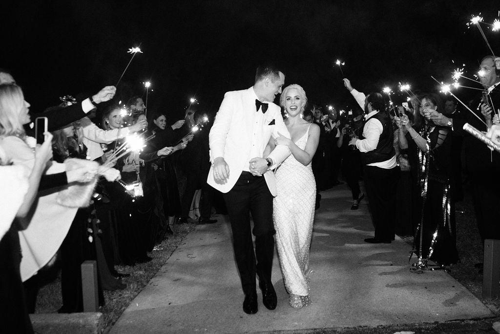 David Peck custom designed a beaded white silk bias cut gown for Caroline Looke Benak's wedding.