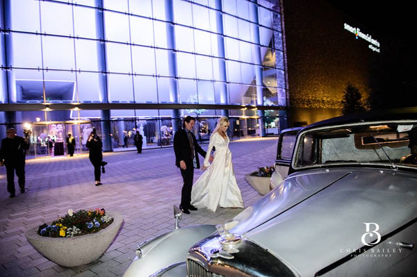 Amy West and Gary Becker wedding at Smart Financial Center in Surgarland, Custom gown by David Peck.