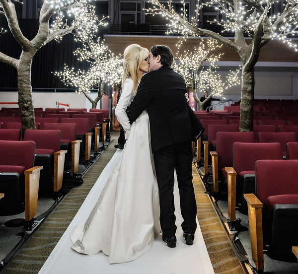 Amy West and Gary Becker wedding at Smart Financial Center in Sugarland, Custom gown by David Peck.