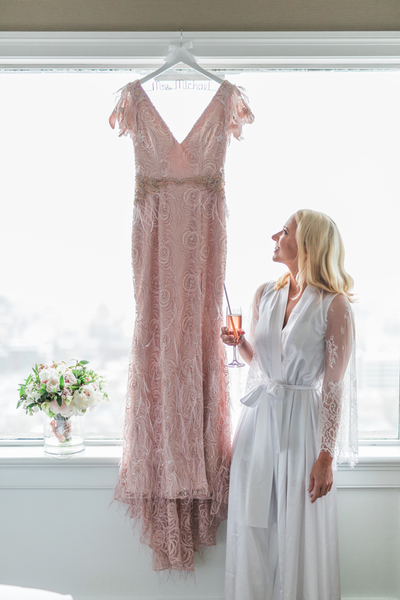 Custom Pink Wedding gown with beading and feathers for Ashley Seippel's San Francisco wedding at the Fairmont. Gown by David Peck