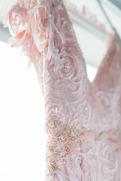 Blush pink lace and feather sleeves on a custom gown for an elopement at the Fairmont San Francisco
