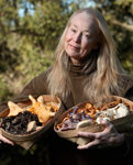 Connie Green holding baskets of wild mushrooms in The Press Democrat, December 1 2015 feature, Oregon Chanterelles Flood Sonoma County Markets by Diane Peterson - photo courtesy The Press Democrat