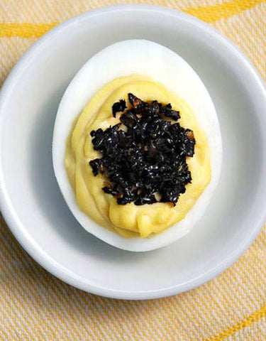 Deviled Eggs with dollop of Black Trumpet Caviar made with Wine Forest Wild Food Premium Dried Wild Black Trumpet Mushrooms