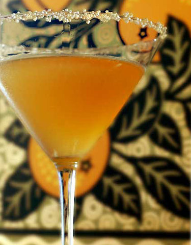 Sugar-rimmed glass of Candy Cap Crowned Sidecar Cocktail  made with Wine Forest Wild Foods Candy Cap Mushroom Sugar
