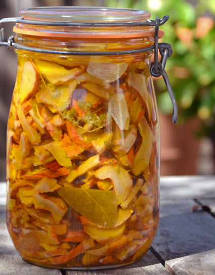 Funghi Sott’olio, or pickled lobster mushrooms in a jar with oil and herbs