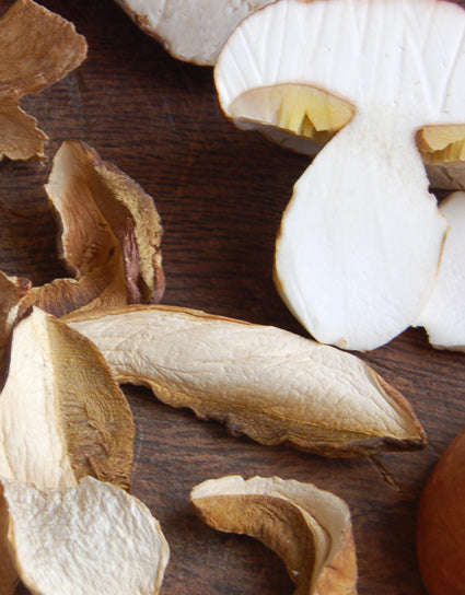 Fresh and dried slices of porcini mushrooms for Porcini Butter