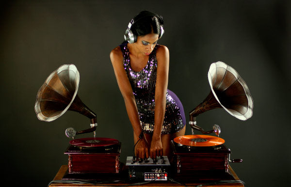 Woman in headphones DJ with gramophones for the hip hop shop