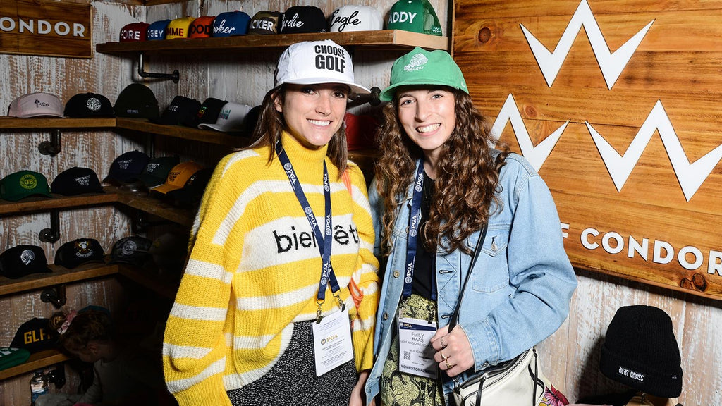 Golf.com girls trying on some new gear at the birds of condor booth in orlando for 2020 PGA Show 