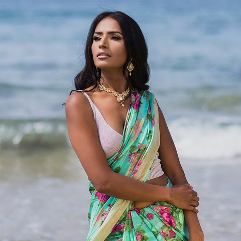 Bengali woman wearing sari on the beach